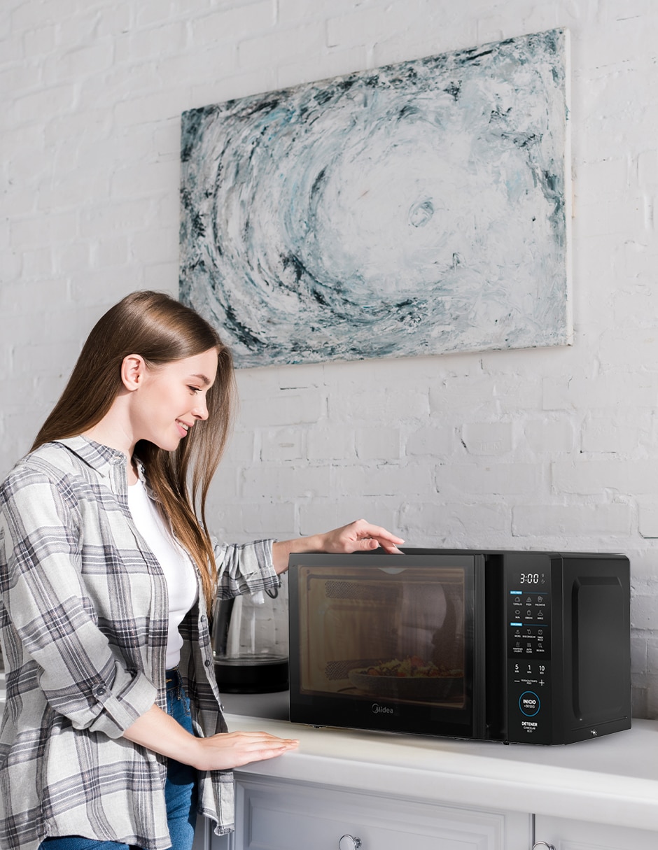 Horno de microondas convencional modelo MMDT11S2MB de 1.1 pies cúbicos 4